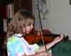 [Clara practicing on her new violin]