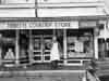 [Louis Tibbetts and Tibbetts' Country Store at it's 20th anniversary - February 1963]